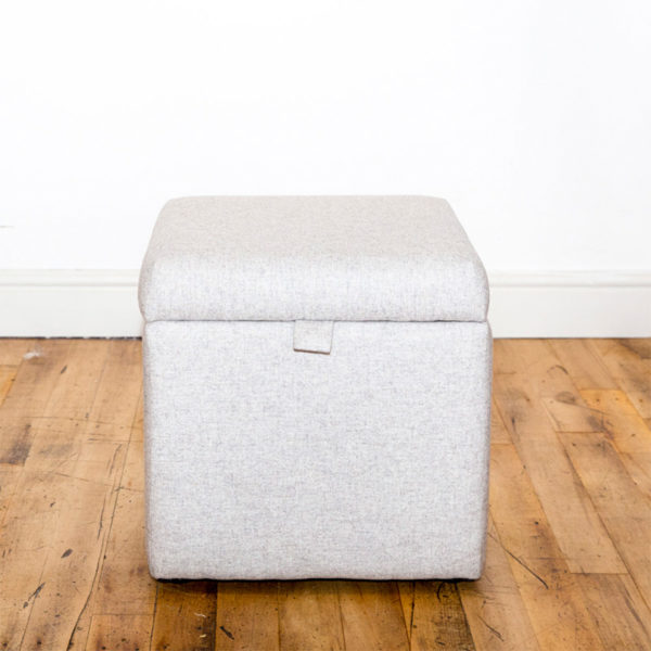 See this Bespoke Linen Footstool Storage Box in your home? The piece comes upholstered in a white linen fabric and has a lift up top for optional storage.